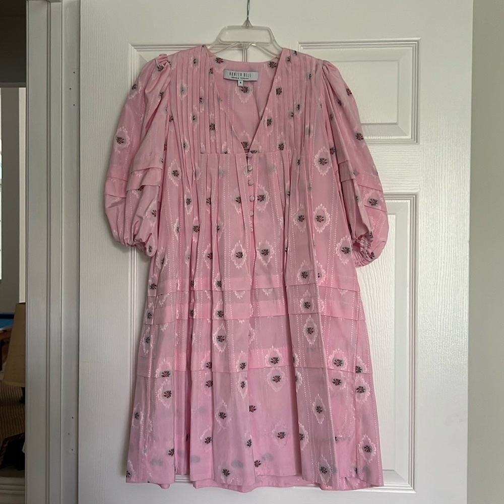 Adorable baby doll hunter bell mini Jenkins dress in light pink with flowers.